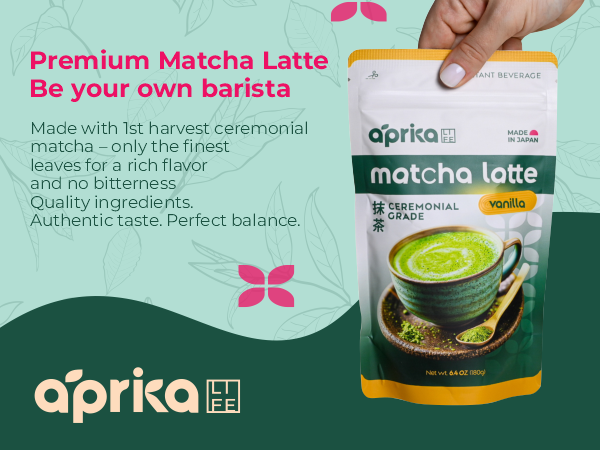 A hand holds a bag of aprika matcha latte next to a green matcha latte in a cup on a decorative background.