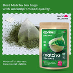 A package of Japanese Matcha Green Tea Bags, a matcha tea bag, and loose ceremonial-grade matcha powder are arranged on a green background.