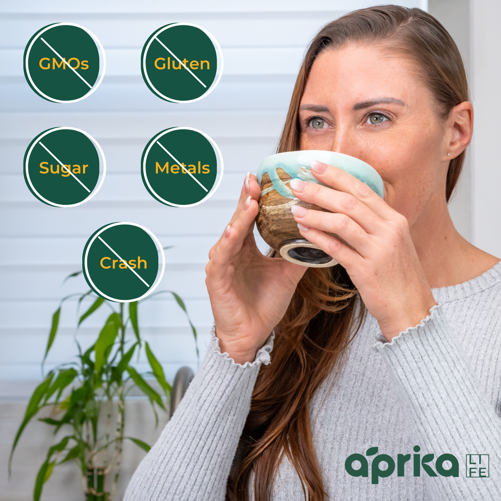 A woman delights in a nourishing bowl boosted with Organic Japanese Ceremonial Grade Matcha Green Tea Powder, free from GMOs, gluten, sugar, and metals. The Aprika Life logo ensures quality and sustainability in every sip without the crash.