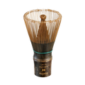 The Dark Matcha Bamboo Whisk (100 Prongs) brings ceremonial matcha tea to life with its exquisite bristles and dark handle. More than a tool, it's an ideal gift for anyone who appreciates the art of tea-making.