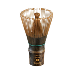 The Dark Matcha Bamboo Whisk (100 Prongs) brings ceremonial matcha tea to life with its exquisite bristles and dark handle. More than a tool, it's an ideal gift for anyone who appreciates the art of tea-making.