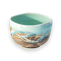 The Japanese Matcha Tea Bowl Blue & Brown Glaze is crafted from Minoyaki pottery, with a turquoise interior and a textured blue and brown exterior—perfect for your Japanese matcha set.