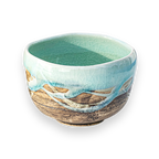 The Japanese Matcha Tea Bowl Blue & Brown Glaze is crafted from Minoyaki pottery, with a turquoise interior and a textured blue and brown exterior—perfect for your Japanese matcha set.