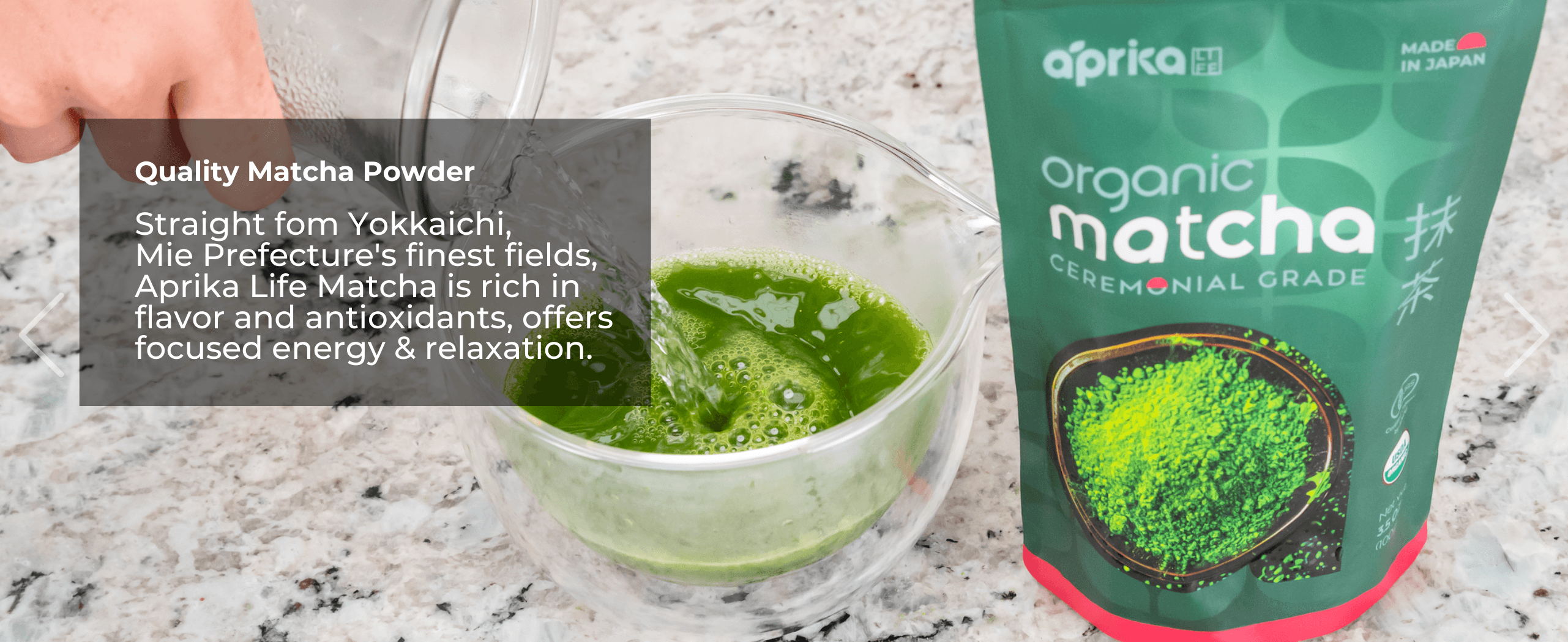 A hand pours water into a bowl of green matcha powder next to a bag labeled "Aprika Organic Matcha.