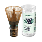 The Dark Matcha Bamboo Whisk (100 Prongs) comes with a container, ideal for ceremonial Matcha tea preparation. Labeled "aesthetic black whisk," it's a unique gift for tea enthusiasts seeking both style and functionality.
