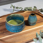 Ceremonial Matcha Starter Kit - Blue: Includes a ceramic bowl with green matcha tea, whisk holder, and wooden tray, inspired by Japanese tea ceremonies—ideal for authentic matcha preparation.