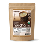 A brown bag of Hojicha Green Tea Powder, a roasted Japanese green tea, displays a cup of tea and product details on the label.