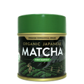 Green tin of Organic Japanese Ceremonial Grade Matcha Green Tea Powder featuring mountain and field illustrations on the label.