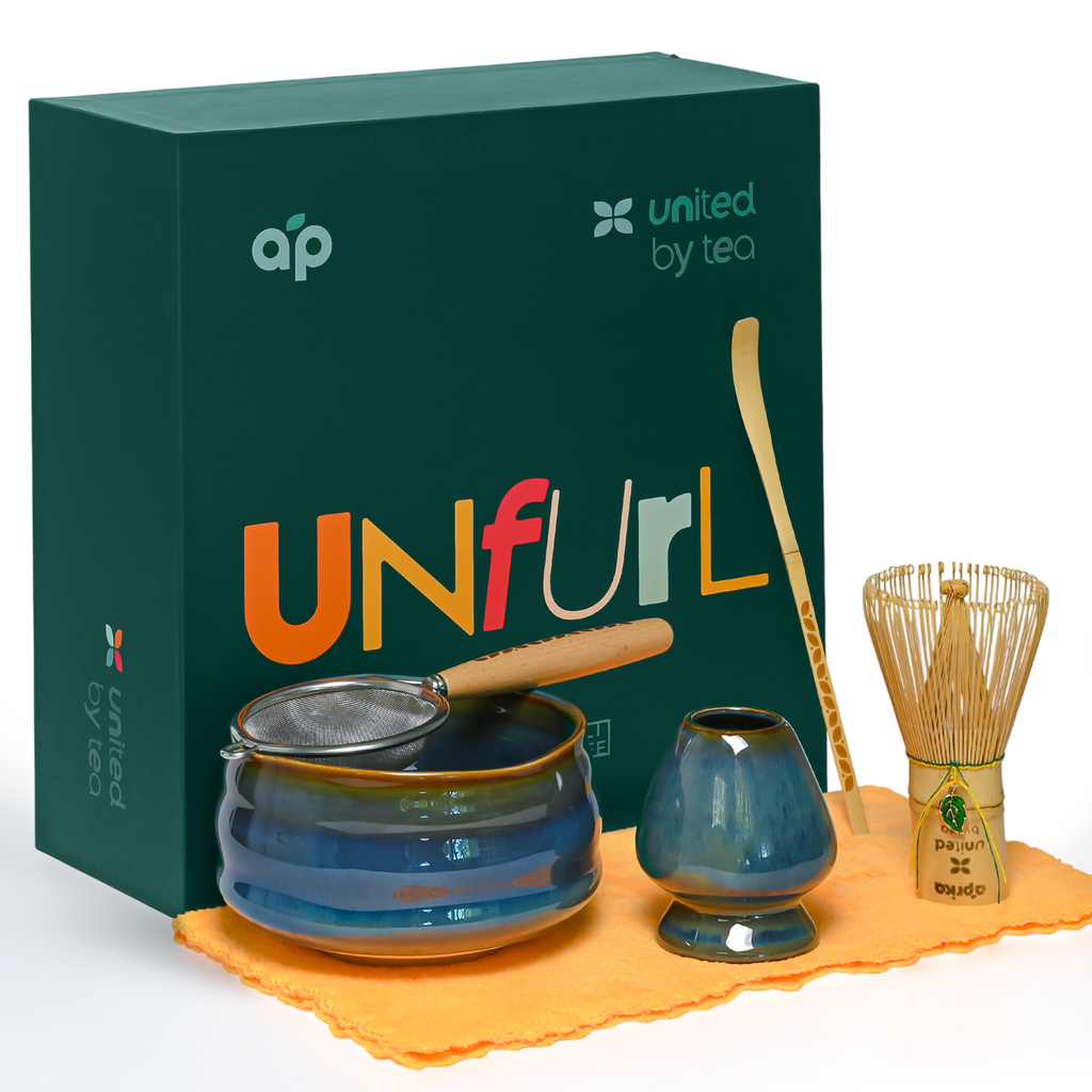 The Ceremonial Matcha Starter Kit - Blue by united by tea includes a bowl, whisk, scoop, strainer, cloth, and is inspired by Japanese tea ceremonies—your perfect set of matcha accessories in a sleek "UNFURL" box.