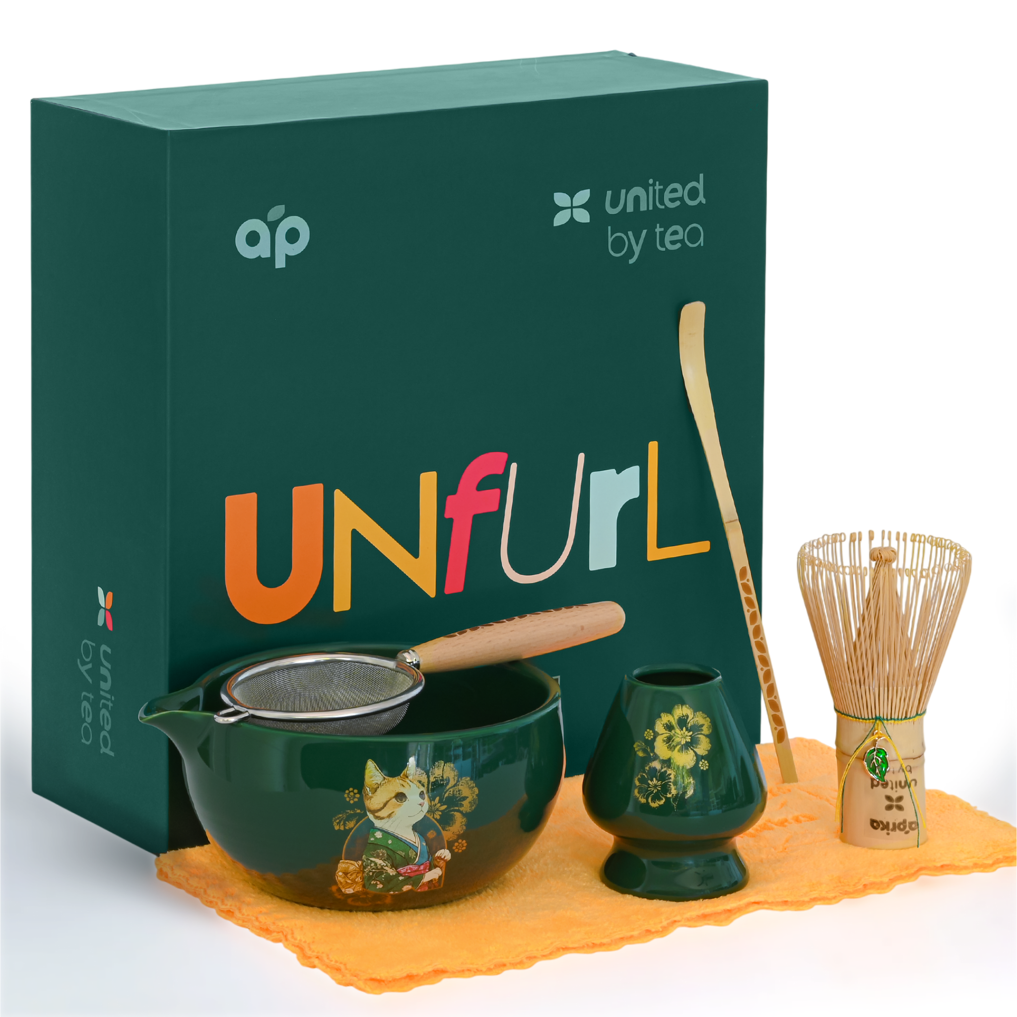 The Green Unfurl Matcha Gift Set includes a matcha bowl, whisk, strainer, scoop, and towel—all elegantly presented with a green "UNfurl" gift box for an elevated matcha tea experience.