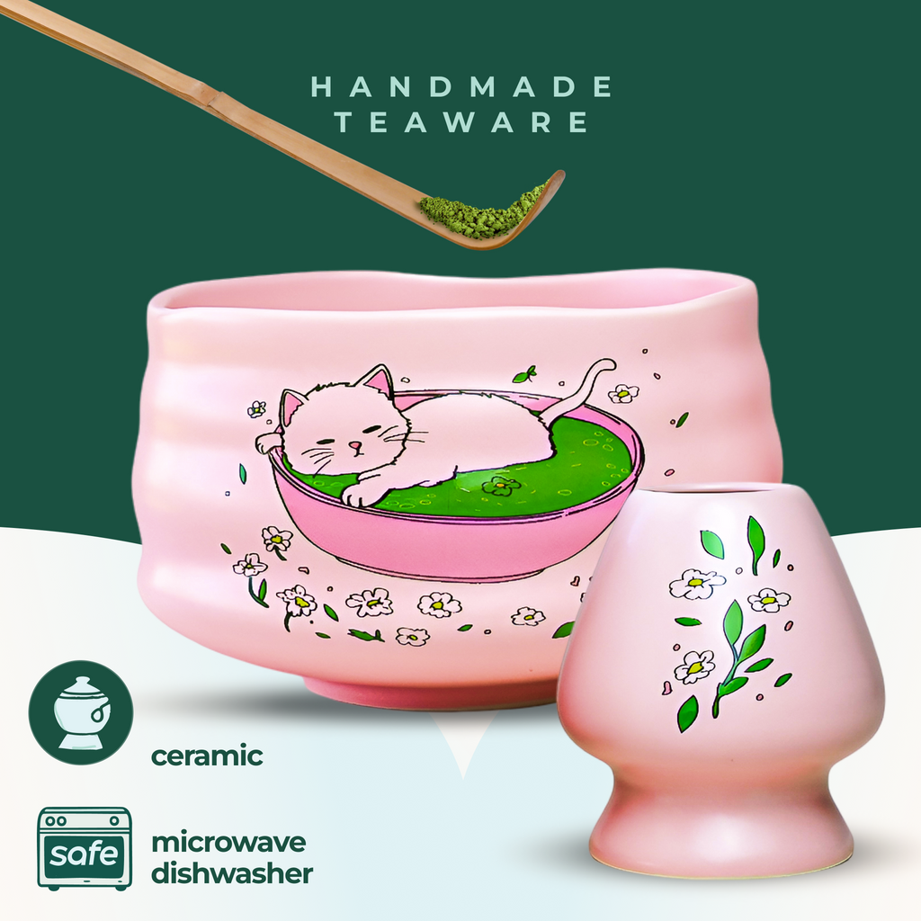 The Pink Unfurl Matcha Gift Set features pink ceramic teaware with hand-painted cat and flower designs. Microwave and dishwasher safe, it makes the perfect gift for matcha lovers.